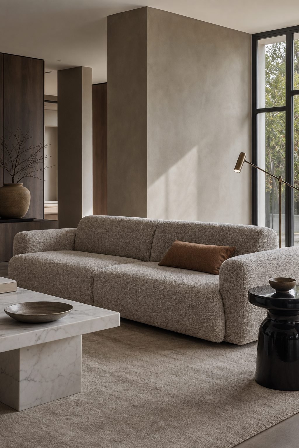 Warm gray boucle 3 seater sofa adding sculptural texture to a modern living room