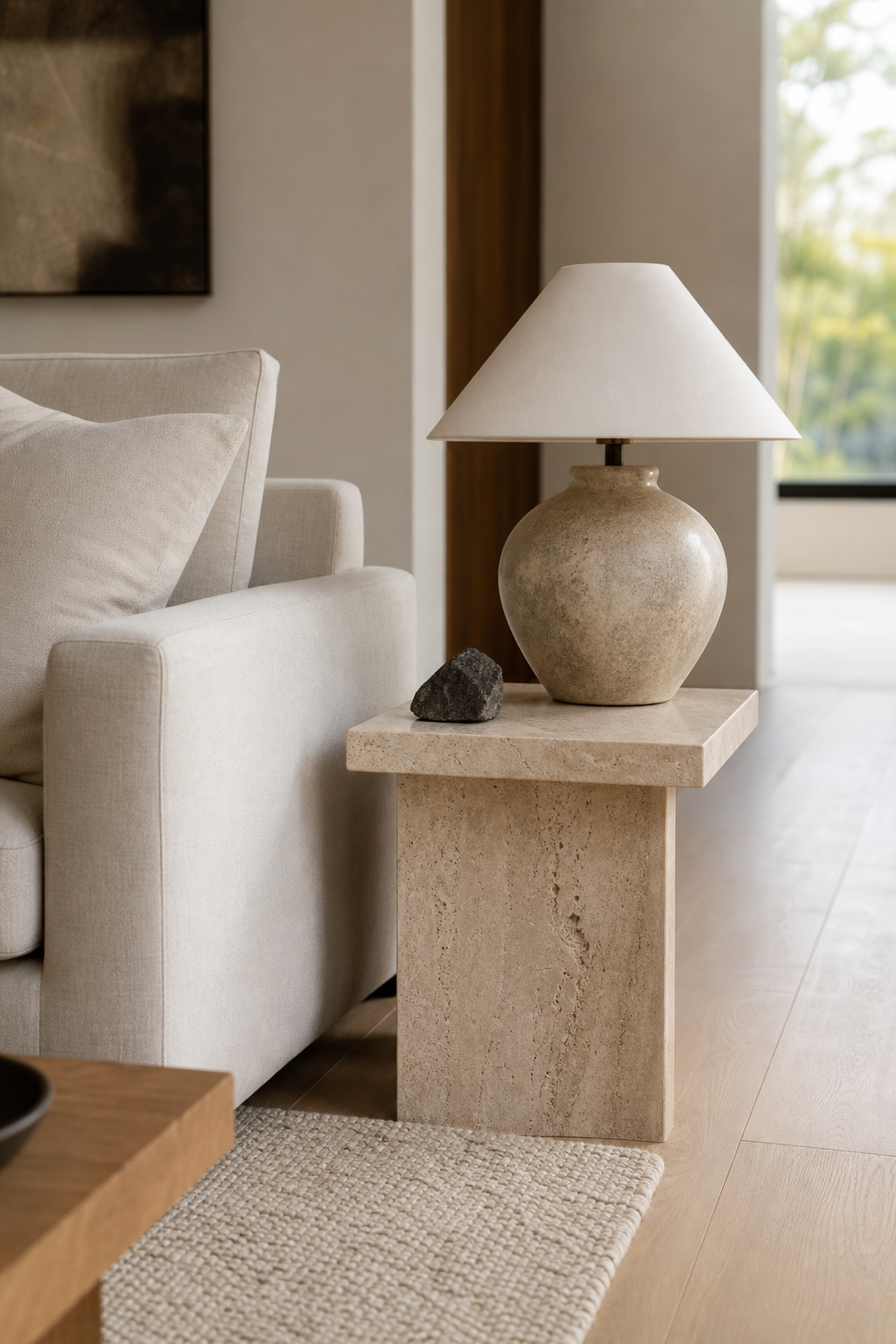 Japandi living room with small honed travertine side table