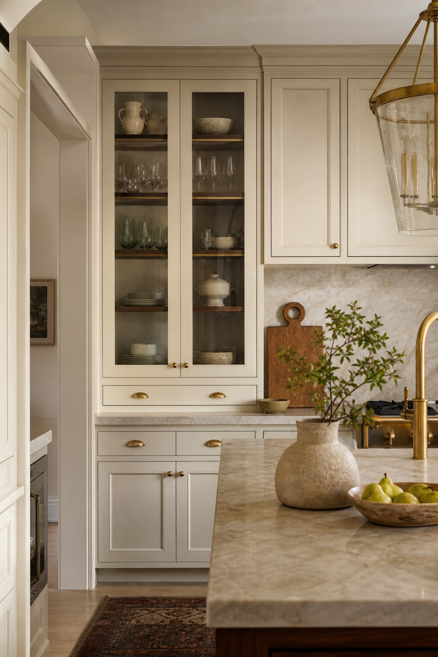 Functional warm neutral kitchen with closed storage and display cabinet