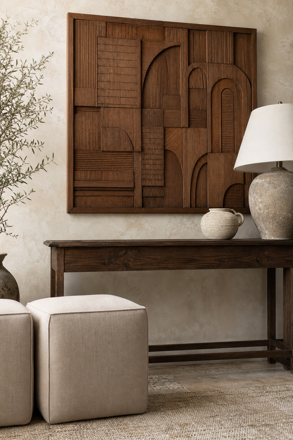 Carved wood panel wall hanging above console
