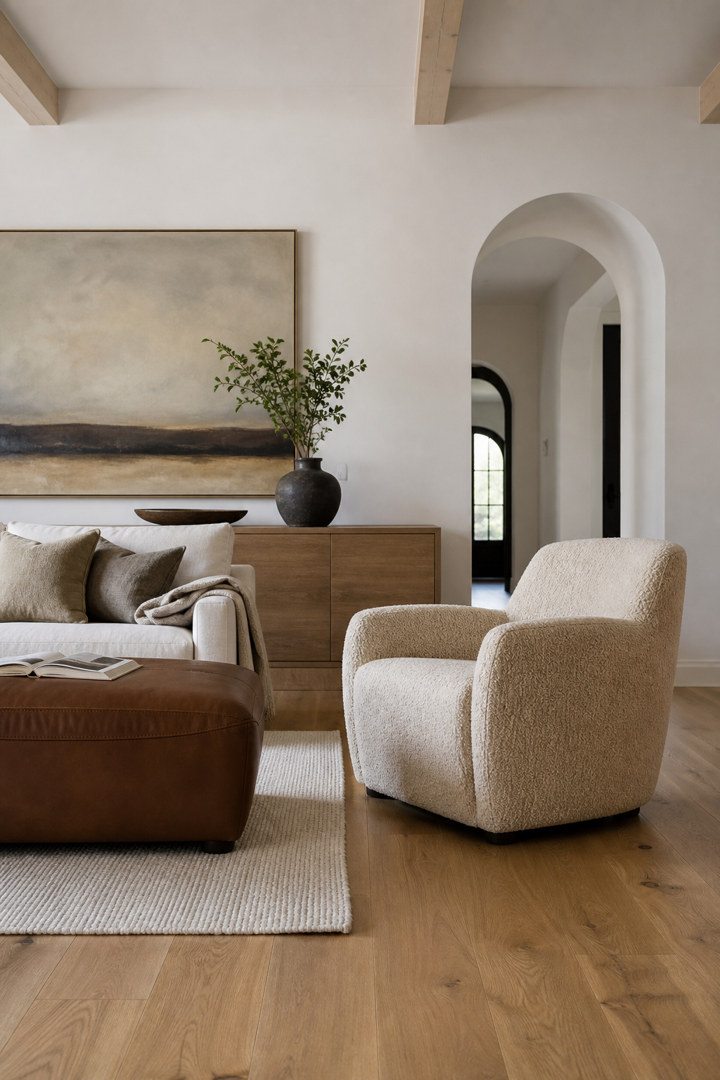 mix boucle with smooth leather in a cozy minimalist living room