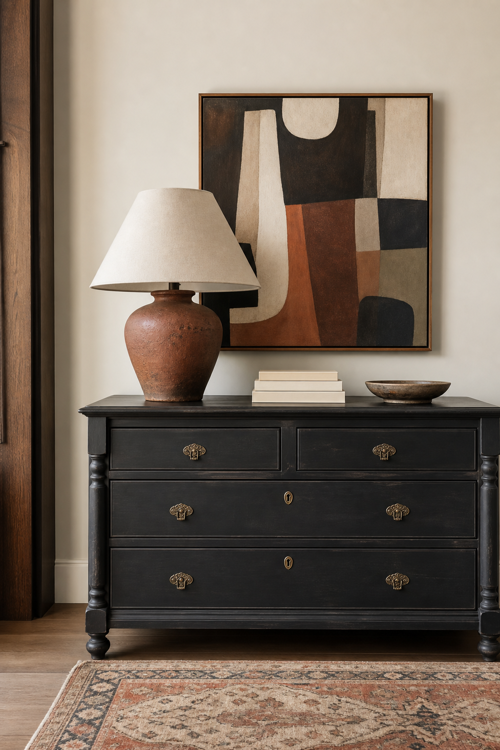 Painted black vintage dresser with modern art