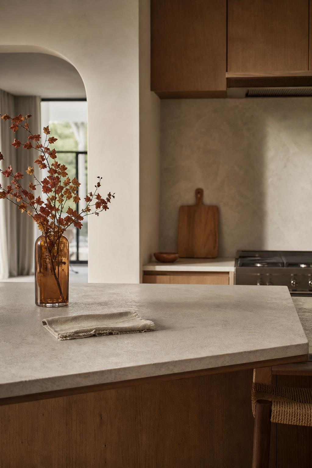 edited counters with one warm accent in a warm functional kitchen