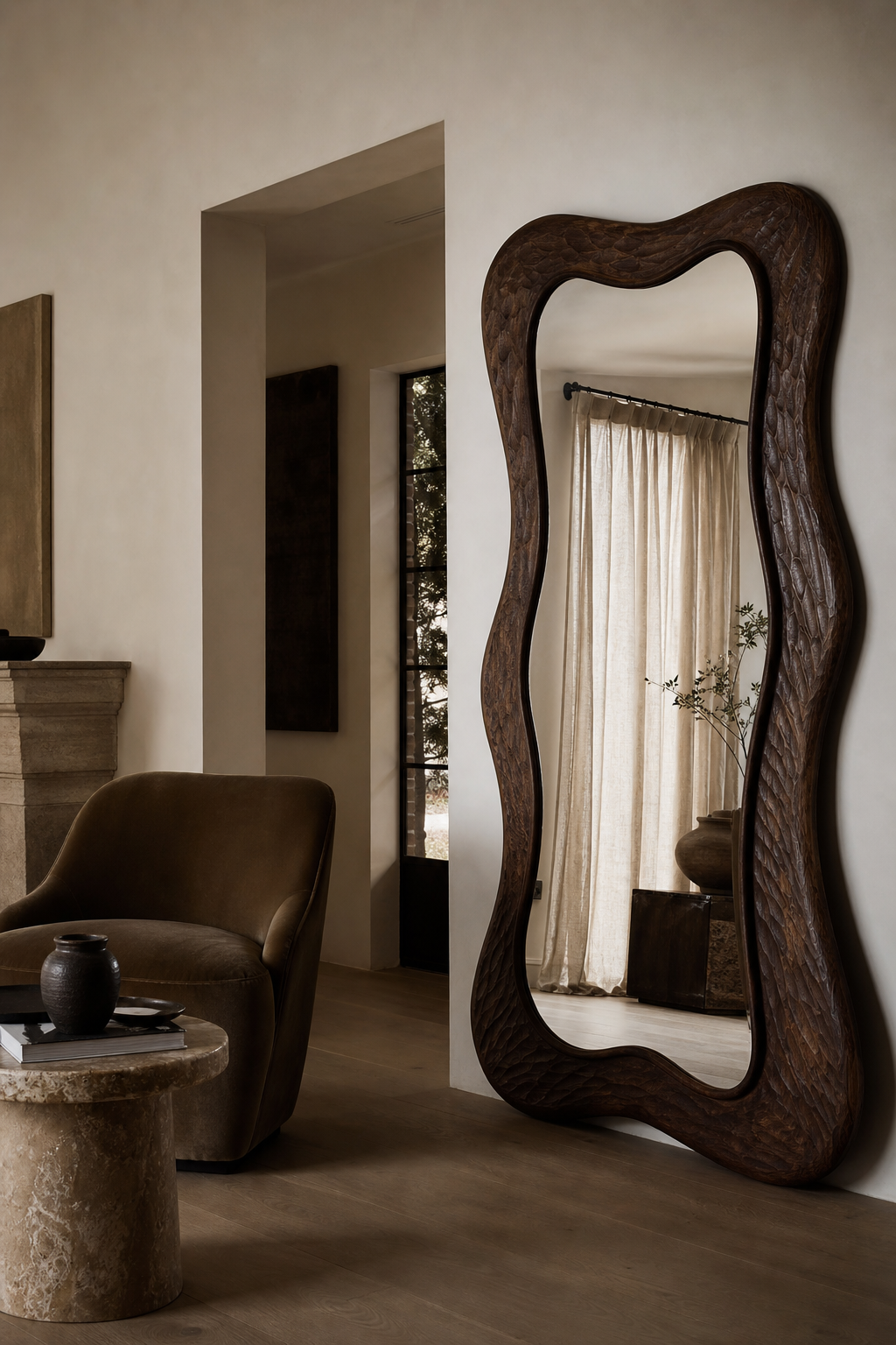 Statement standing mirror acting as sculptural art in a luxury interior