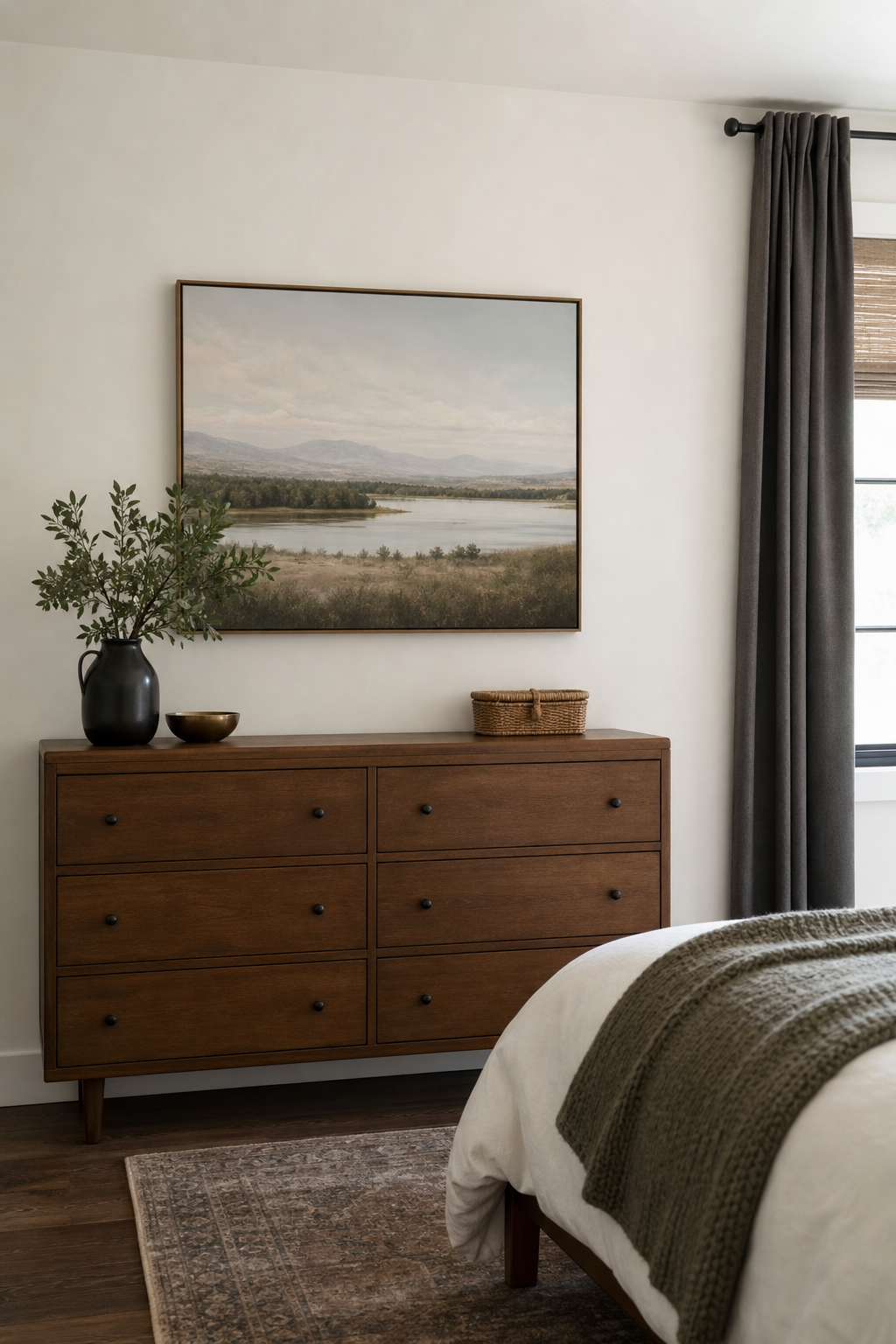 Small bedroom with one calm artwork and generous breathing room